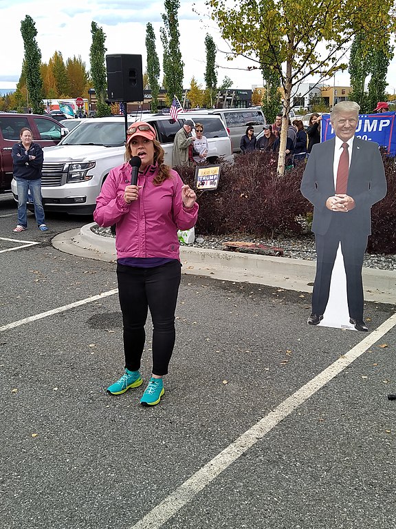 Eagle River Assemblyperson Jamie Allard meets with a cardboard cutout of Donald Trump at a pro-Trump rally in 2020.